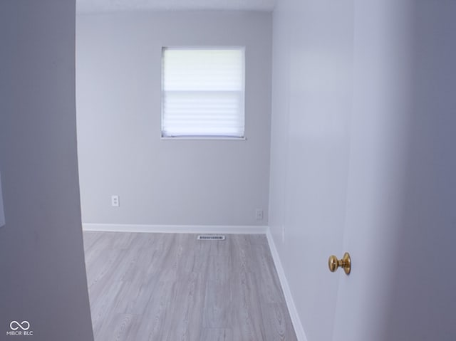 spare room with light wood-type flooring