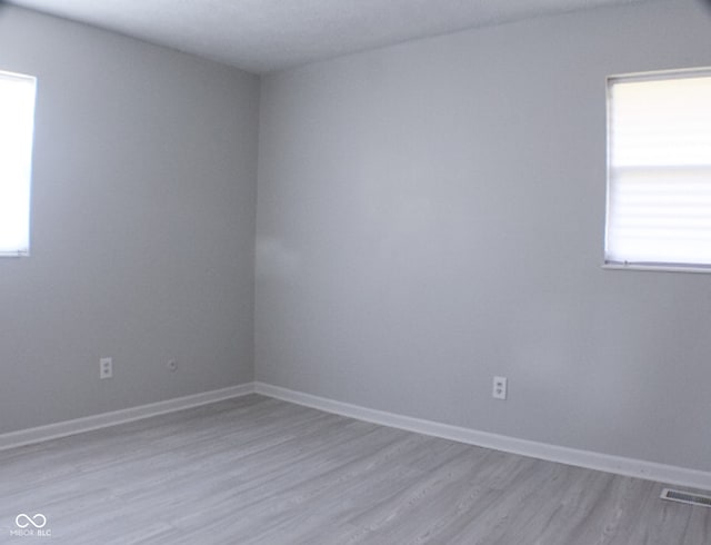 unfurnished room featuring light hardwood / wood-style flooring