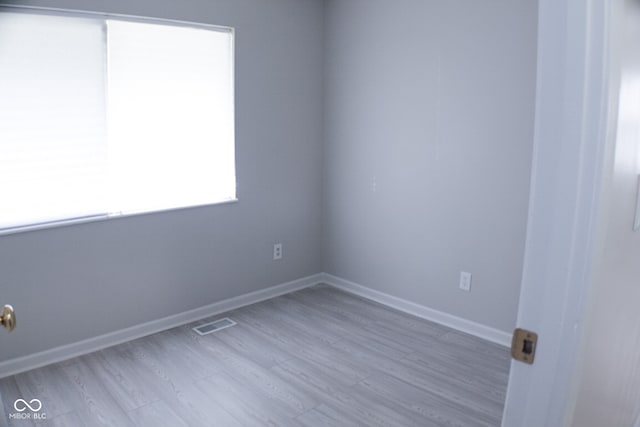 unfurnished room featuring hardwood / wood-style floors