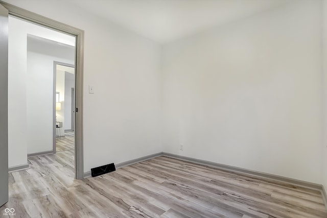 unfurnished room featuring light hardwood / wood-style flooring