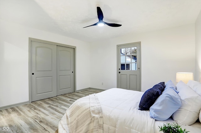 bedroom featuring a closet, ceiling fan, and light hardwood / wood-style flooring