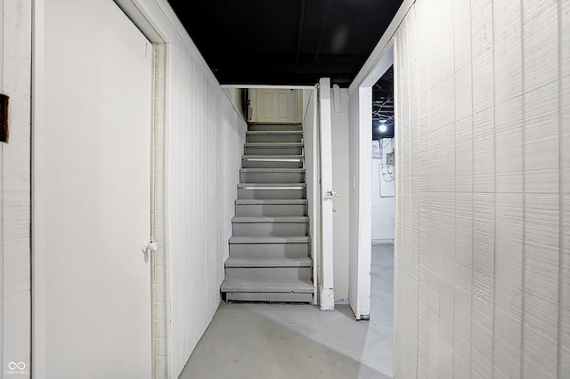 stairway with concrete floors