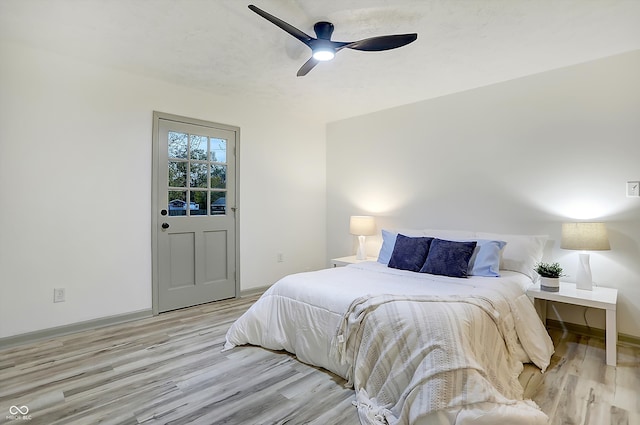 bedroom featuring light hardwood / wood-style flooring and ceiling fan