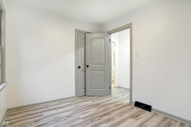 unfurnished room with light hardwood / wood-style floors