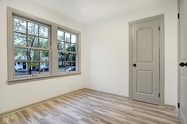 unfurnished room featuring light wood-type flooring