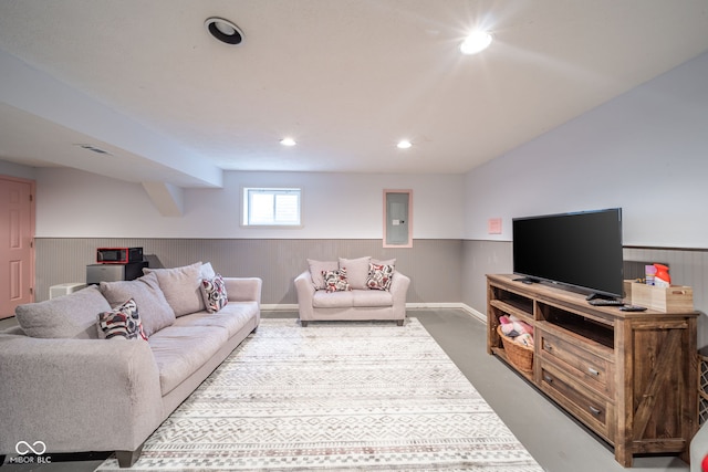 living room featuring concrete floors and electric panel