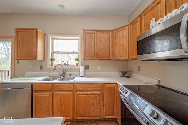 kitchen with sink and appliances with stainless steel finishes