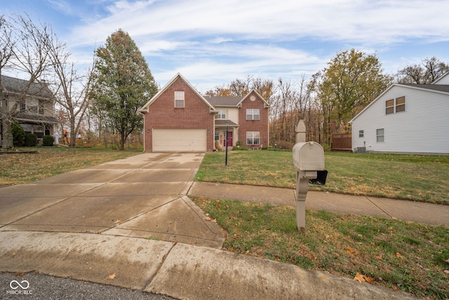 view of front property featuring a front lawn and a garage