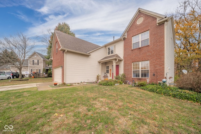 view of property with a front lawn and a garage