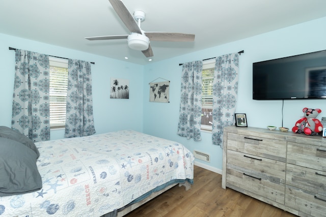 bedroom with hardwood / wood-style flooring and ceiling fan