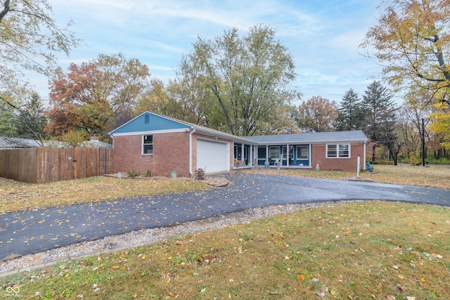 single story home with a front lawn and a garage