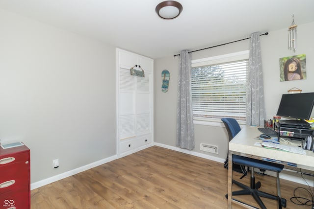 home office featuring hardwood / wood-style flooring