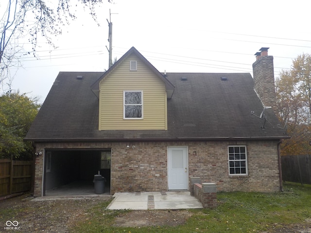 back of house with a garage