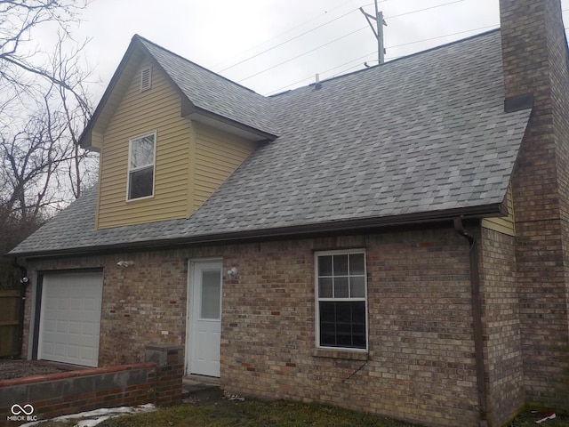 back of house with a garage