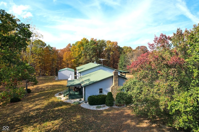 view of home's exterior with a yard