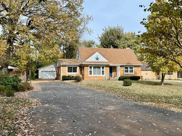 view of front of home with an outbuilding and a garage