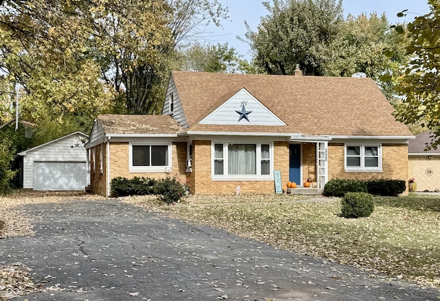 view of front of property with an outbuilding and a garage