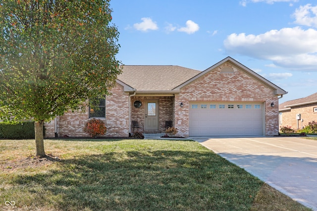 view of front of property featuring a garage and a front lawn