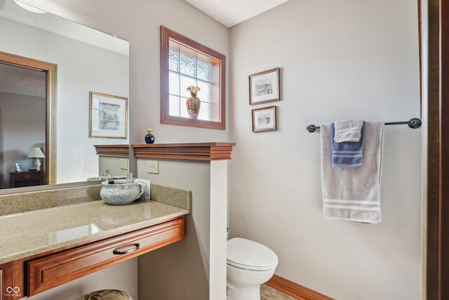 3784 Mansfield Dr, Brownsburg, IN 46112 - half bathroom with toilet, vanity, and baseboards