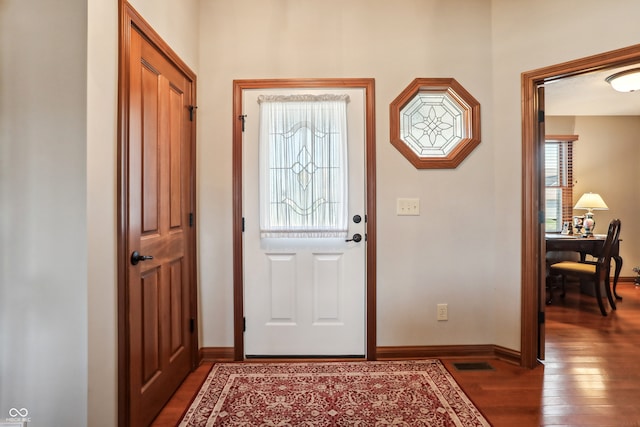 foyer entrance with dark wood-type flooring