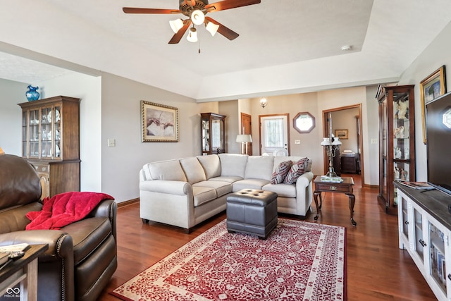 living room with dark wood-type flooring and ceiling fan