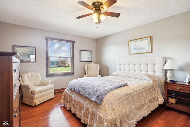 bedroom with dark wood-type flooring and ceiling fan