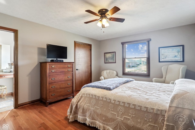 3784 Mansfield Dr, Brownsburg, IN 46112 - bedroom with light wood-type flooring, ceiling fan, and baseboards