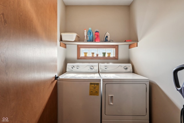 washroom with separate washer and dryer