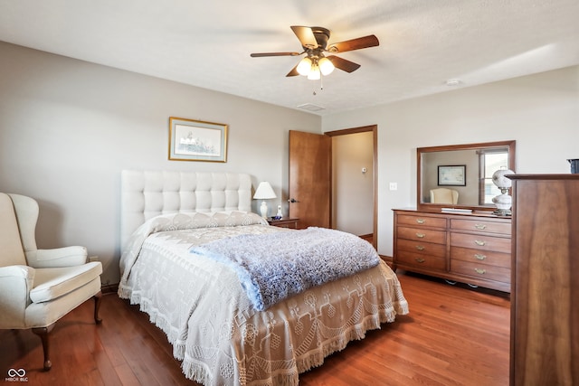 bedroom with ceiling fan and wood-type flooring