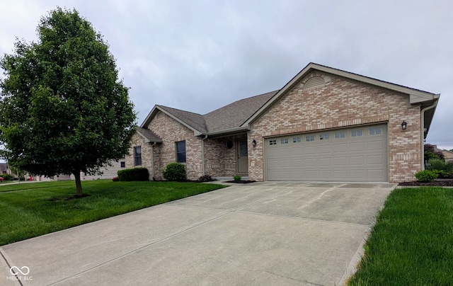3784 Mansfield Dr, Brownsburg, IN 46112 - single story home with brick siding, concrete driveway, an attached garage, and a front lawn