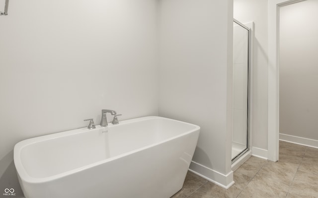 bathroom with a shower with shower door and sink