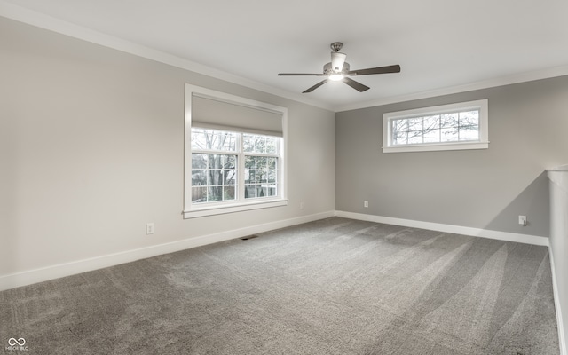 spare room featuring ceiling fan, a healthy amount of sunlight, and ornamental molding