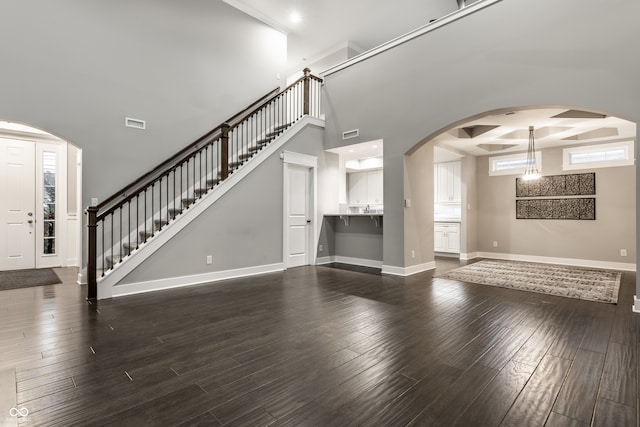 unfurnished living room with dark hardwood / wood-style floors