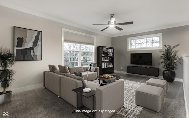 carpeted living room featuring plenty of natural light, ceiling fan, and crown molding