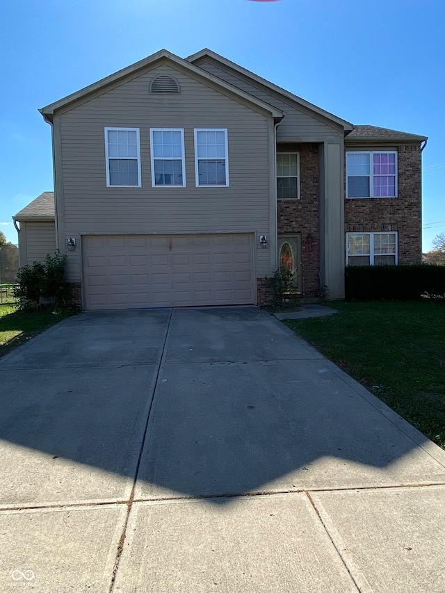 view of front of property with a garage