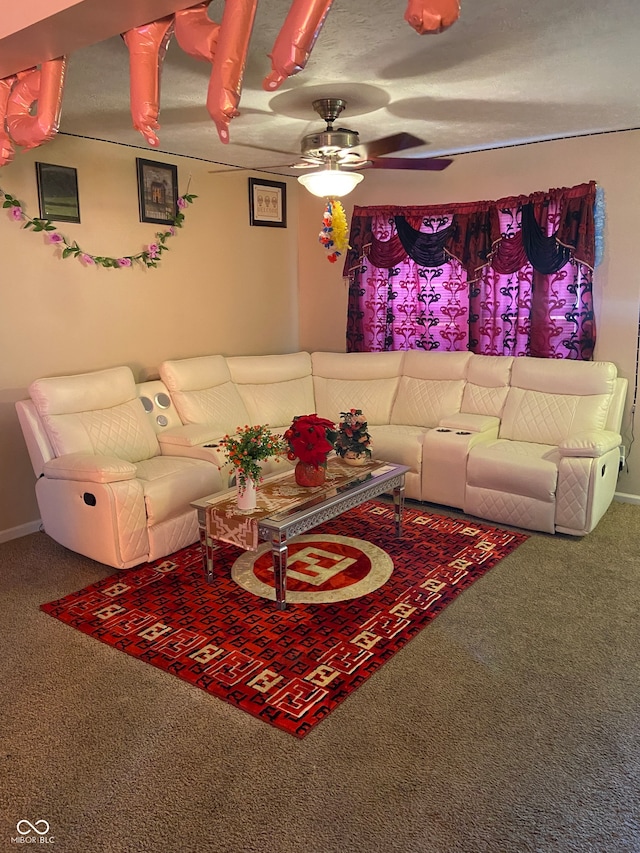 living room featuring ceiling fan and carpet