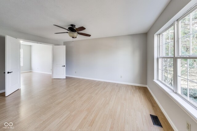534 Austrian Way, Avon, IN 46123 - spare room featuring ceiling fan, baseboards, and light wood-type flooring