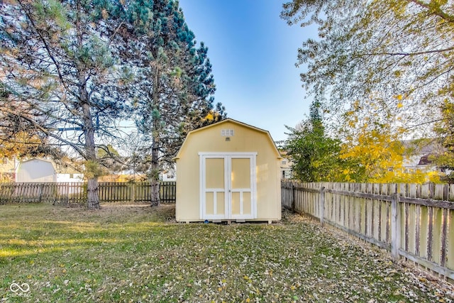 view of outdoor structure featuring a lawn