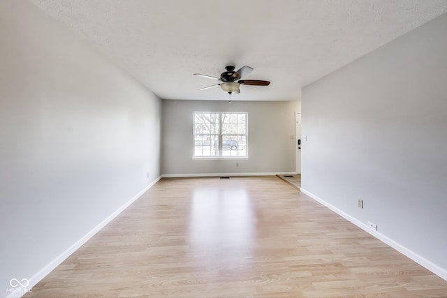 534 Austrian Way, Avon, IN 46123 - spare room with ceiling fan, light wood-type flooring, baseboards, and a textured ceiling