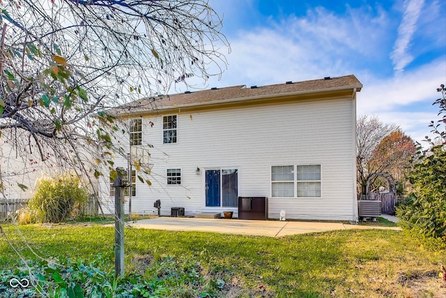 back of house featuring a yard, cooling unit, and a patio area