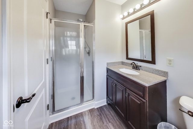 534 Austrian Way, Avon, IN 46123 - bathroom featuring a stall shower, vanity, and wood finished floors