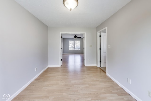 534 Austrian Way, Avon, IN 46123 - unfurnished room with light wood finished floors, baseboards, and ceiling fan