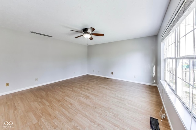 unfurnished room featuring light hardwood / wood-style flooring and ceiling fan