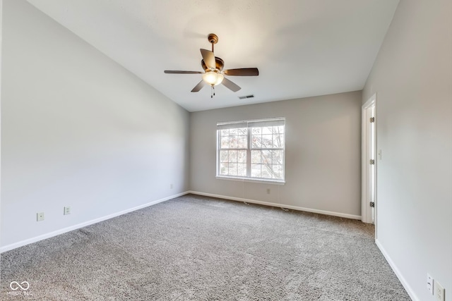 carpeted empty room featuring ceiling fan