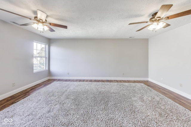 534 Austrian Way, Avon, IN 46123 - spare room featuring a ceiling fan, baseboards, wood finished floors, and a textured ceiling