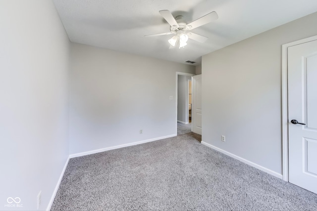 carpeted empty room with ceiling fan