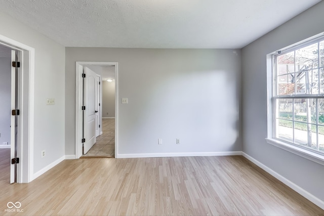 534 Austrian Way, Avon, IN 46123 - spare room with light wood-type flooring, healthy amount of natural light, and baseboards