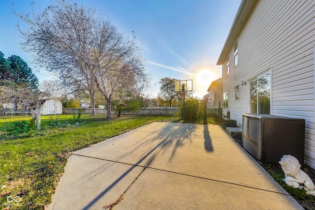 exterior space with a storage unit and basketball court