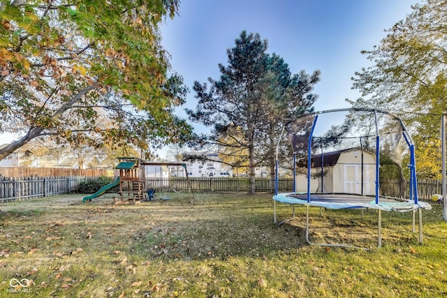 534 Austrian Way, Avon, IN 46123 - view of jungle gym featuring a trampoline, a storage unit, and an outbuilding