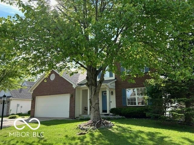 534 Austrian Way, Avon, IN 46123 - view of front of home featuring a garage, a front yard, and brick siding